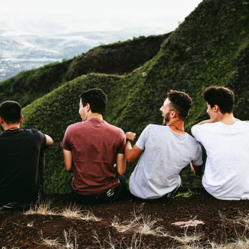 Friends enjoying mountaintop view.